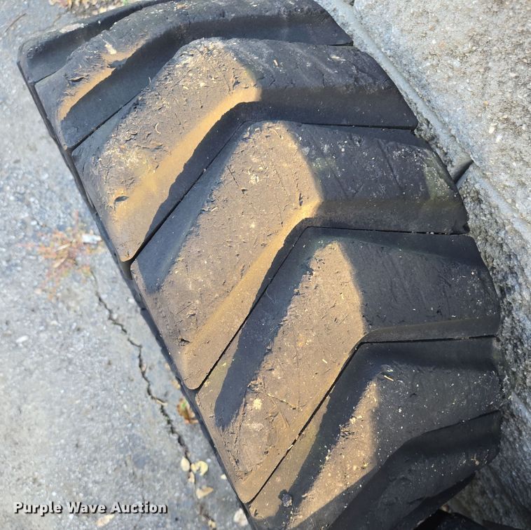 image for item EE8678 (4) skid steer solid tires and wheels