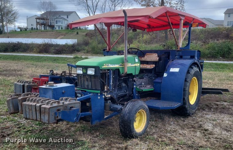 image for item DQ3807 2003 John Deere 5220 tractor with Brouwer sod harvester