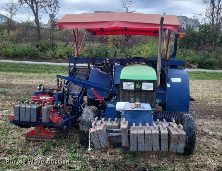 image for item DQ3807 2003 John Deere 5220 tractor with Brouwer sod harvester