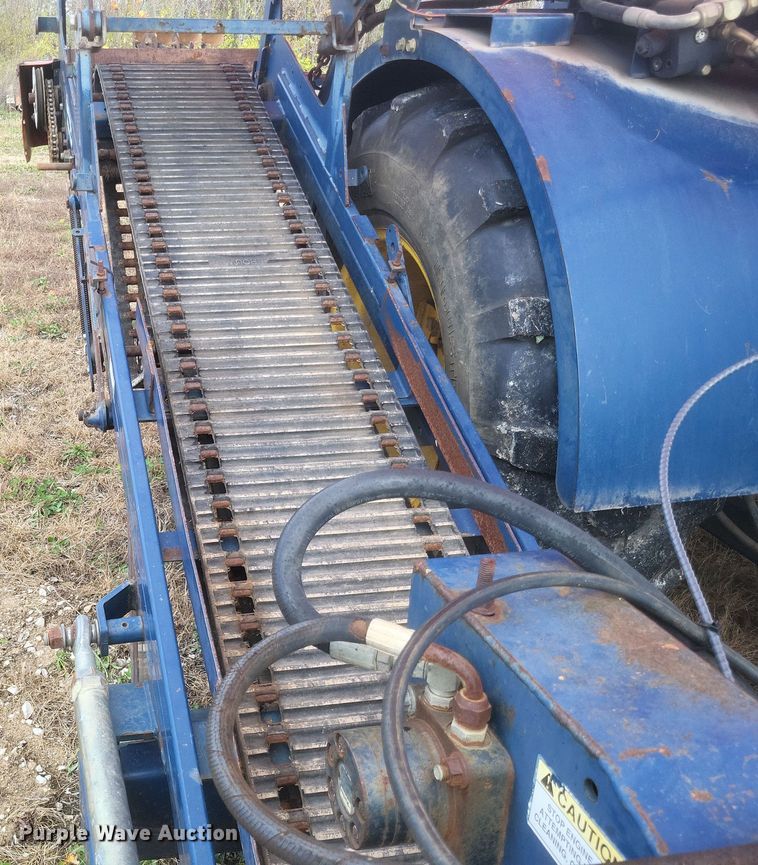 image for item DQ3807 2003 John Deere 5220 tractor with Brouwer sod harvester