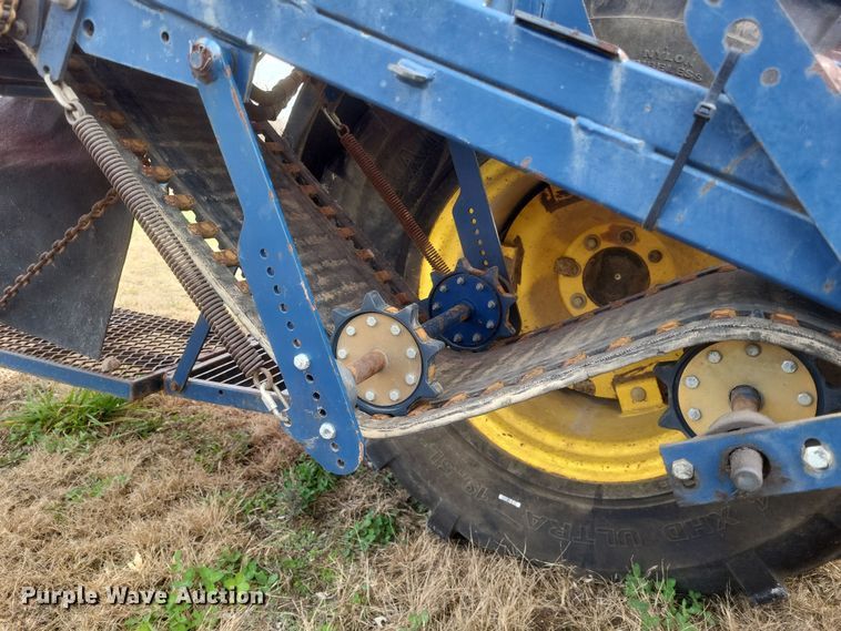 image for item DQ3807 2003 John Deere 5220 tractor with Brouwer sod harvester