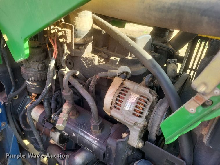 image for item DQ3807 2003 John Deere 5220 tractor with Brouwer sod harvester