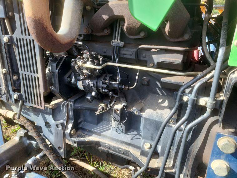 image for item DQ3807 2003 John Deere 5220 tractor with Brouwer sod harvester