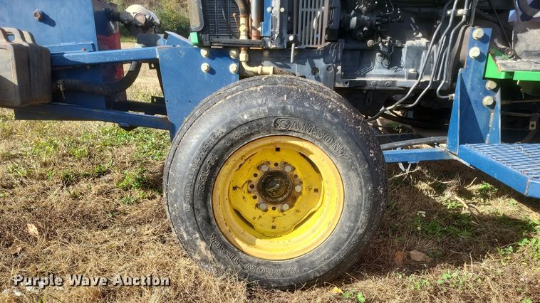 image for item DQ3807 2003 John Deere 5220 tractor with Brouwer sod harvester