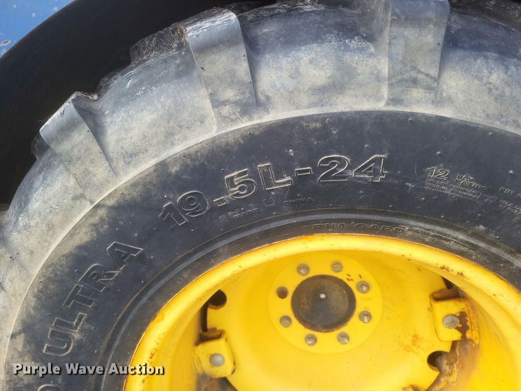 image for item DQ3807 2003 John Deere 5220 tractor with Brouwer sod harvester