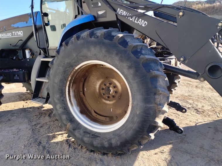 image for item EG9969 2002 New Holland TV140 bi-directional tractor