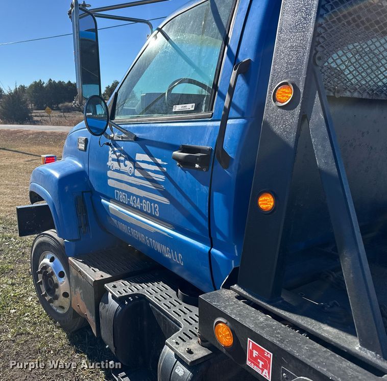 image for item DX3892 1999 GMC C6500 rollback truck