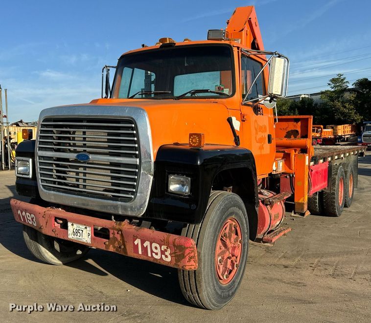 image for item DT2031 1997 Ford  LNT8000 flatbed truck with crane