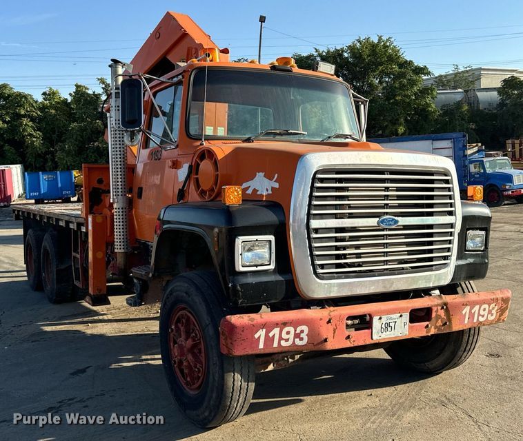 image for item DT2031 1997 Ford  LNT8000 flatbed truck with crane