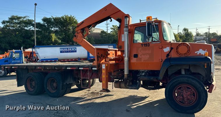 image for item DT2031 1997 Ford  LNT8000 flatbed truck with crane