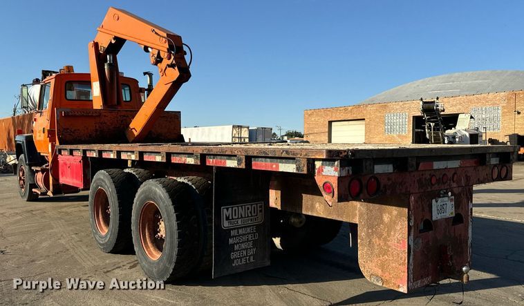 image for item DT2031 1997 Ford  LNT8000 flatbed truck with crane