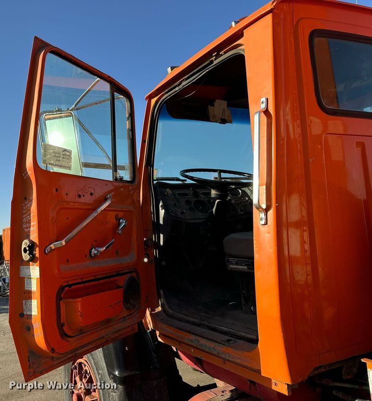 image for item DT2031 1997 Ford  LNT8000 flatbed truck with crane