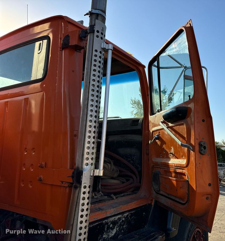 image for item DT2031 1997 Ford  LNT8000 flatbed truck with crane