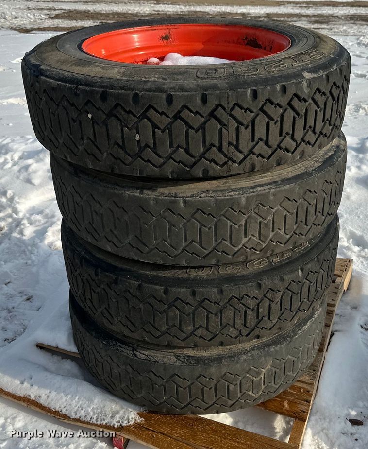 image for item DV0561 (4) 255/70R22.5 skid steer tires and wheels