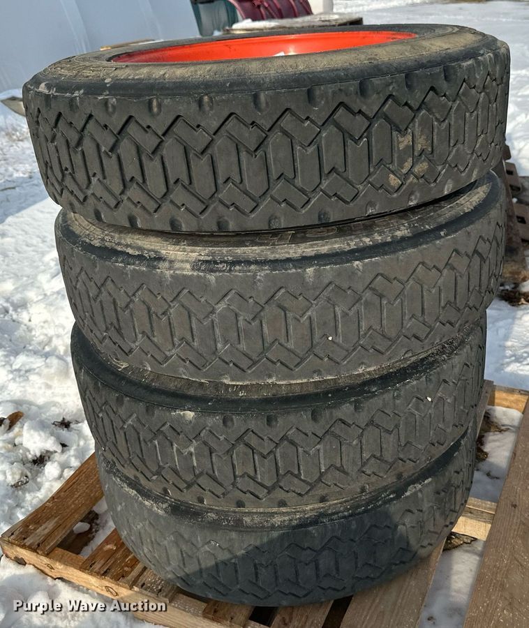image for item DV0561 (4) 255/70R22.5 skid steer tires and wheels