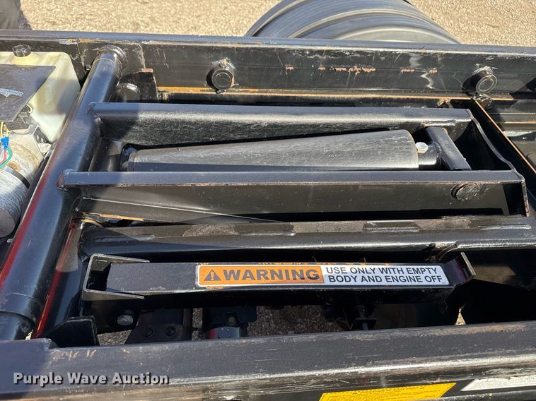 image for item EG2353 2016 Isuzu NPR roll-off container truck