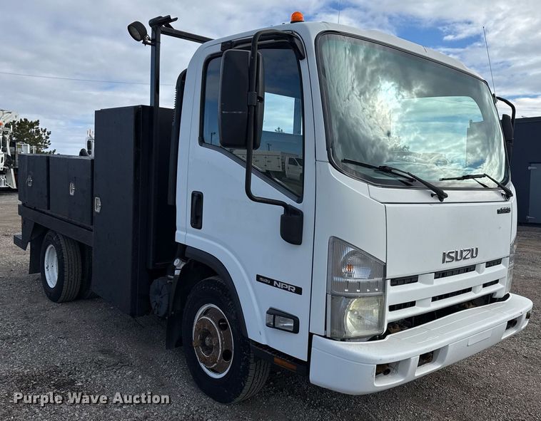 image for item EG2492 2014 Isuzu NPR flatbed truck