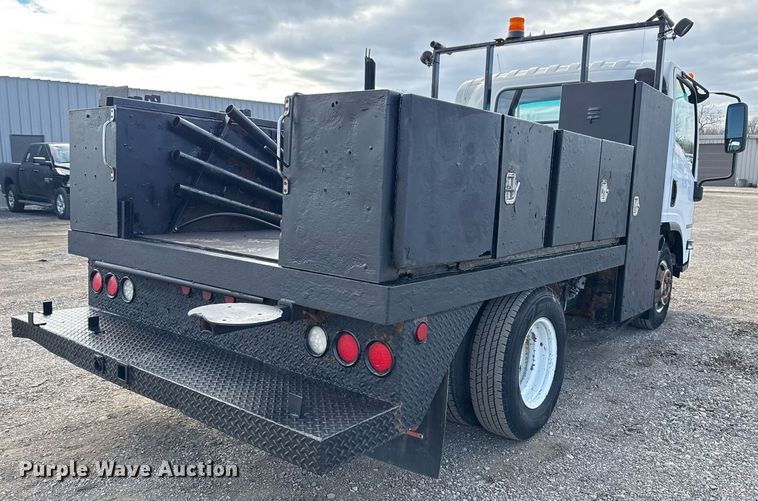 image for item EG2492 2014 Isuzu NPR flatbed truck