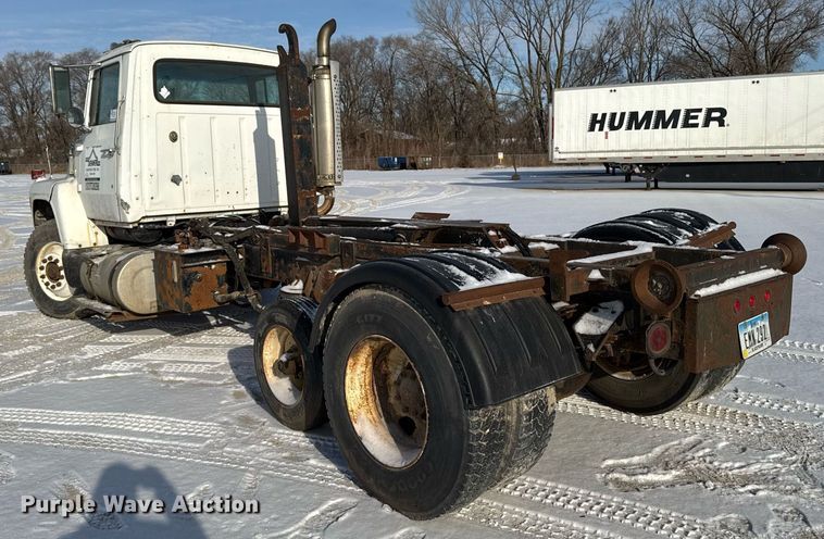 image for item DT0555 1990 Ford L9000 hook lift truck