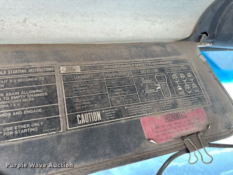 image for item DT0555 1990 Ford L9000 hook lift truck