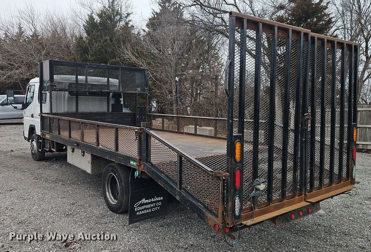 image for item EI8827 2017 Mitsubishi Fuso Canter Crew Cab flatbed truck