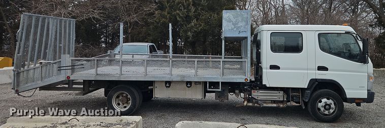 image for item EI8828 2017 Mitsubishi Fuso Canter FE160 Crew Cab flatbed truck