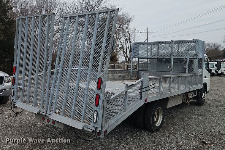 image for item EI8828 2017 Mitsubishi Fuso Canter FE160 Crew Cab flatbed truck