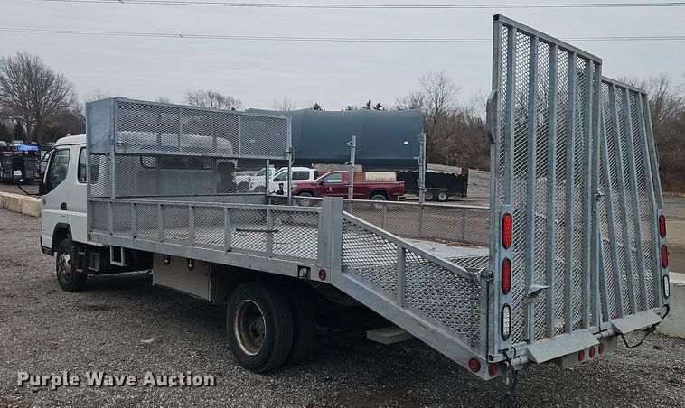 image for item EI8828 2017 Mitsubishi Fuso Canter FE160 Crew Cab flatbed truck
