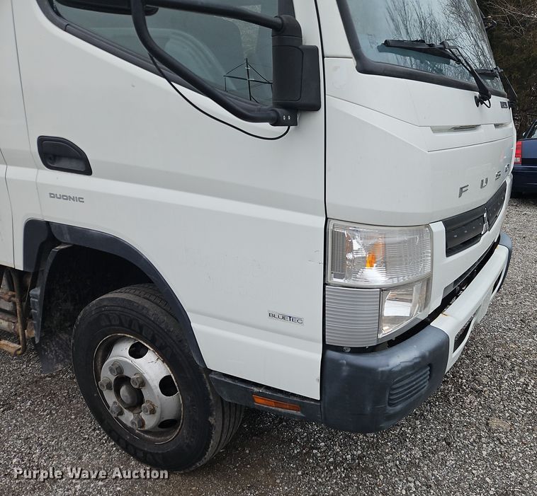 image for item EI8828 2017 Mitsubishi Fuso Canter FE160 Crew Cab flatbed truck