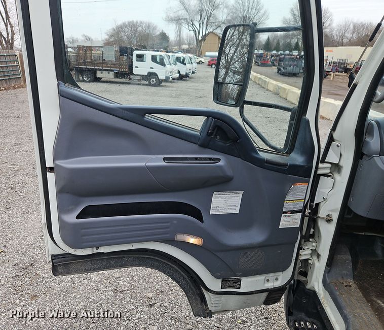 image for item EI8828 2017 Mitsubishi Fuso Canter FE160 Crew Cab flatbed truck