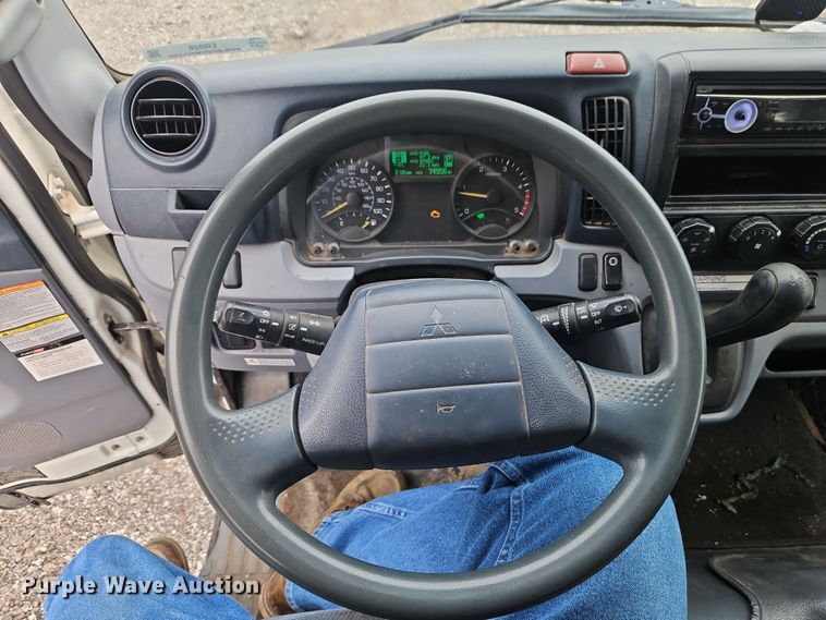 image for item EI8828 2017 Mitsubishi Fuso Canter FE160 Crew Cab flatbed truck