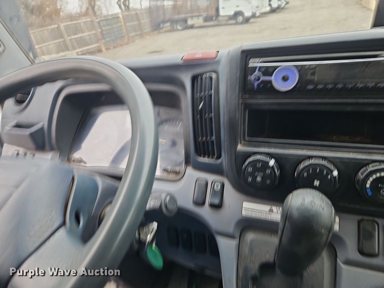 image for item EI8828 2017 Mitsubishi Fuso Canter FE160 Crew Cab flatbed truck