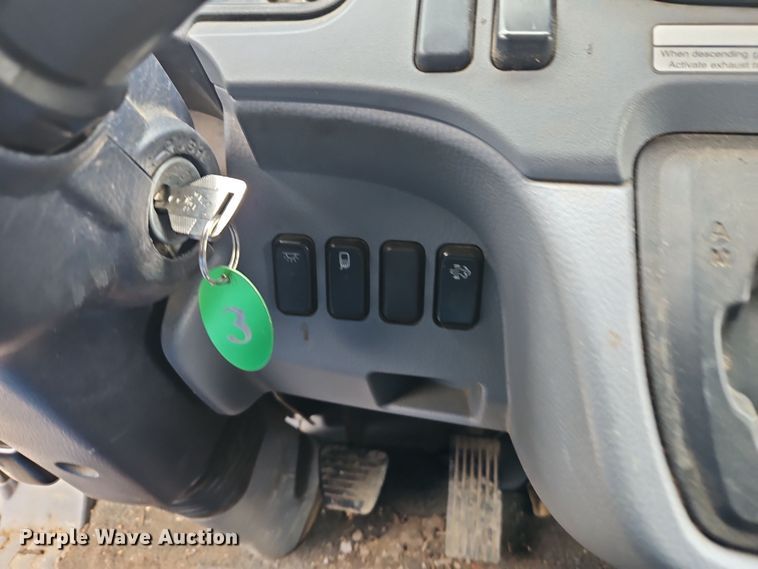 image for item EI8828 2017 Mitsubishi Fuso Canter FE160 Crew Cab flatbed truck