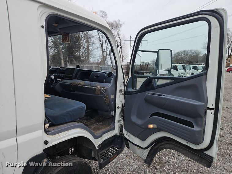 image for item EI8828 2017 Mitsubishi Fuso Canter FE160 Crew Cab flatbed truck