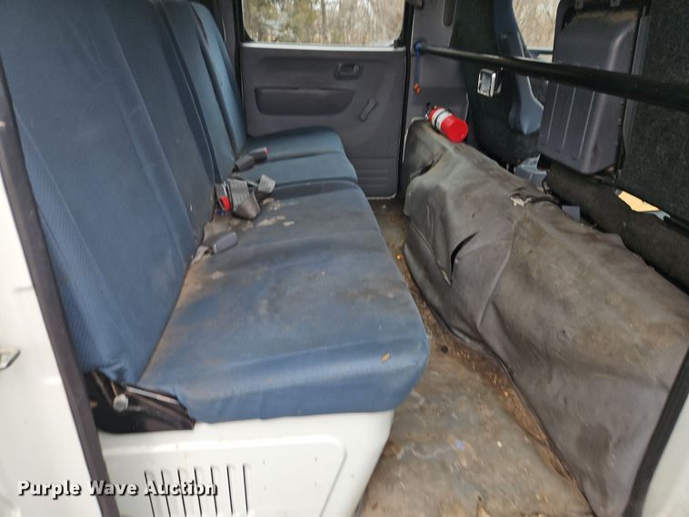 image for item EI8828 2017 Mitsubishi Fuso Canter FE160 Crew Cab flatbed truck