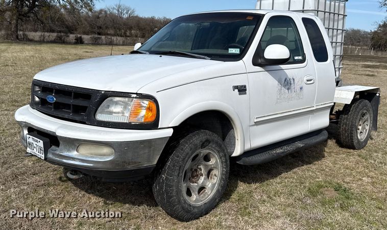 image for item EJ3482 1998 Ford F150 SuperCab flatbed pickup truck 