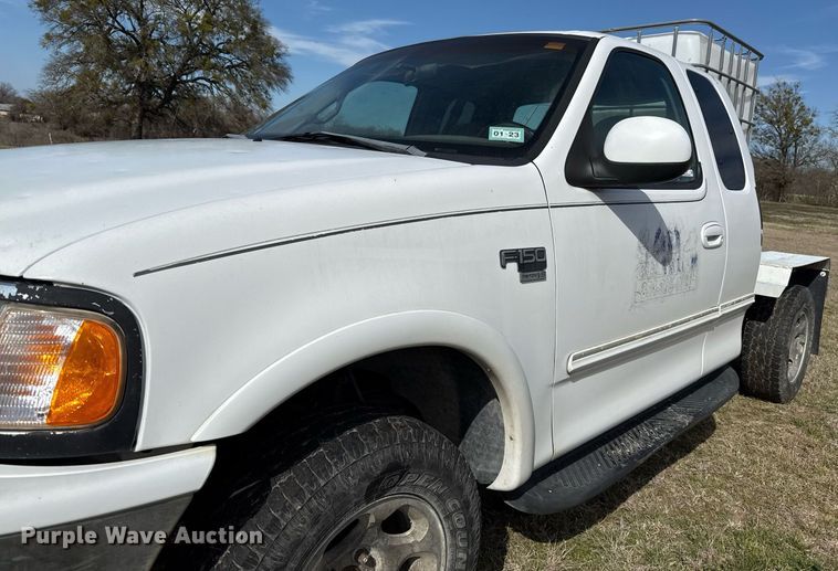 image for item EJ3482 1998 Ford F150 SuperCab flatbed pickup truck 