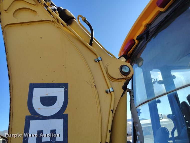 image for item DV6705 2001 John Deere 310G backhoe