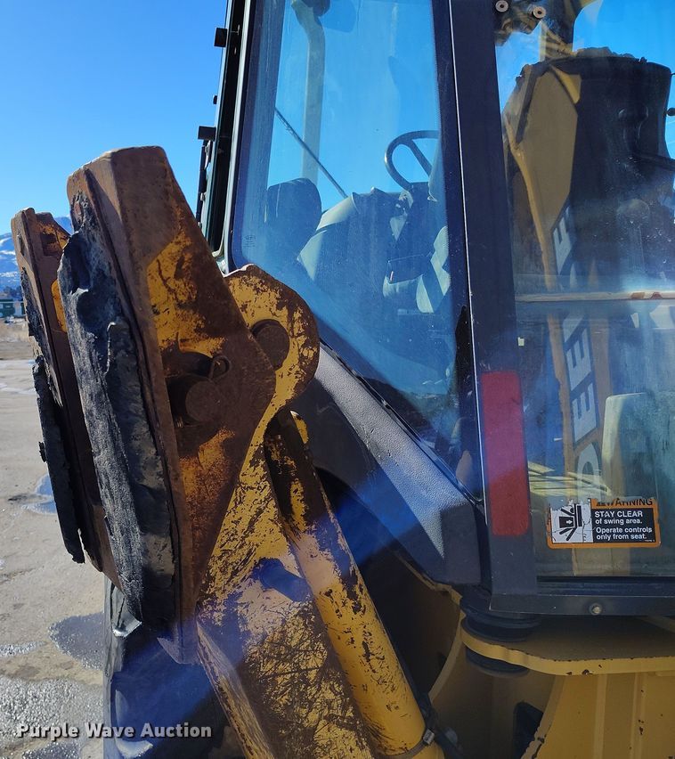 image for item DV6705 2001 John Deere 310G backhoe