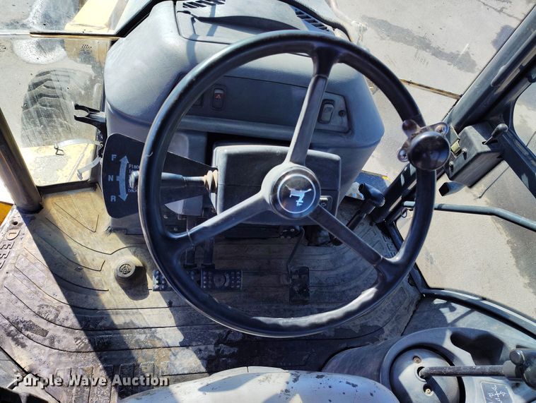 image for item DV6705 2001 John Deere 310G backhoe