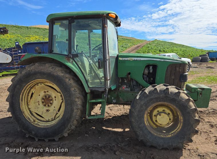 image for item EN6009 2004 John Deere 6415 MFWD tractor