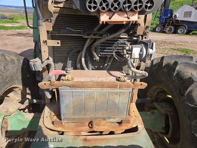 image for item EN6009 2004 John Deere 6415 MFWD tractor