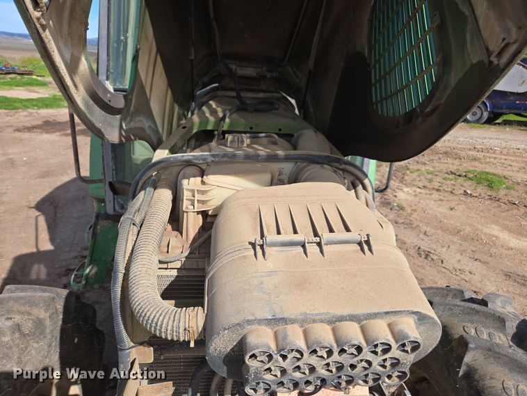 image for item EN6009 2004 John Deere 6415 MFWD tractor