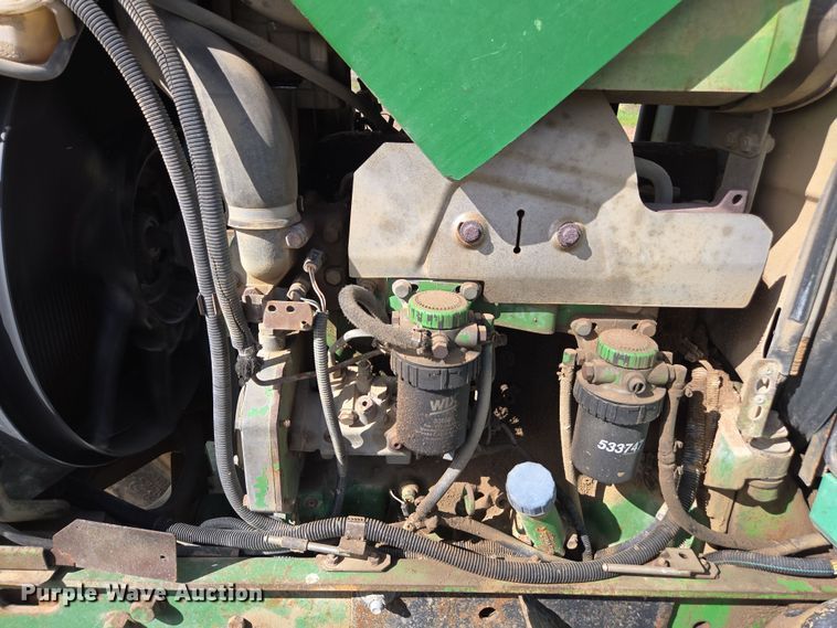 image for item EN6009 2004 John Deere 6415 MFWD tractor