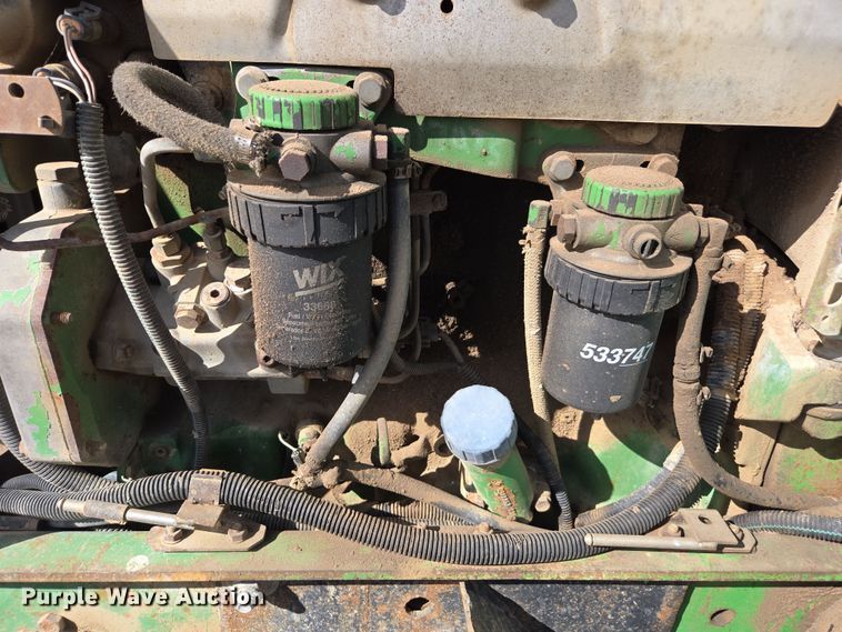 image for item EN6009 2004 John Deere 6415 MFWD tractor