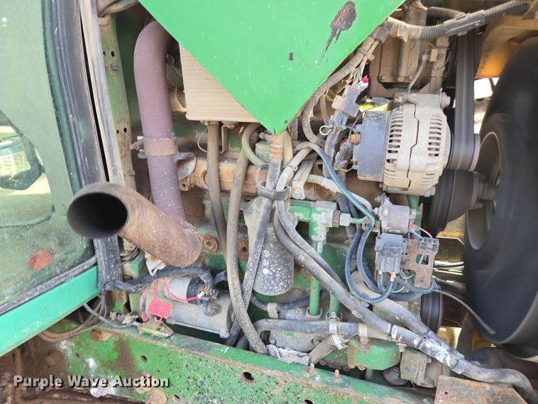 image for item EN6009 2004 John Deere 6415 MFWD tractor