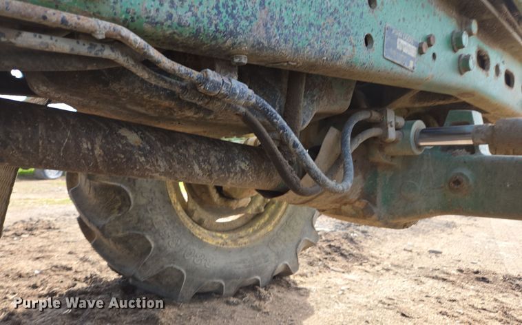 image for item EN6009 2004 John Deere 6415 MFWD tractor