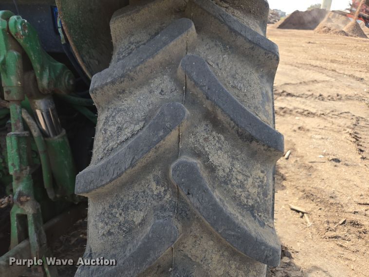 image for item EN6009 2004 John Deere 6415 MFWD tractor