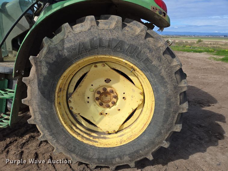 image for item EN6009 2004 John Deere 6415 MFWD tractor