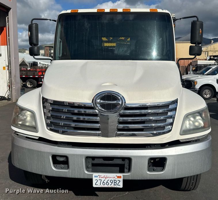 image for item EN6001 2010 Hino 268 flatbed truck with crash attenuator